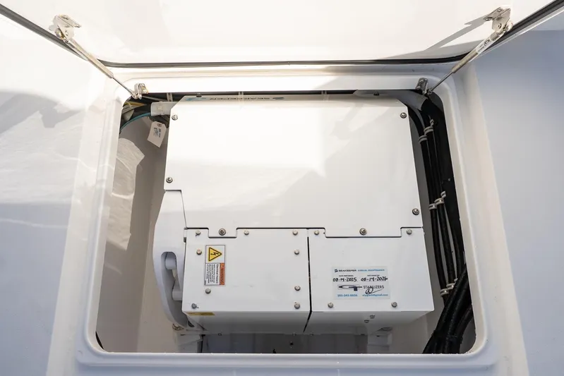 Wahoo Whitney Yacht Photos Pics 2022 Valhalla Boatworks V-37 engine compartment with visible machinery and wiring.