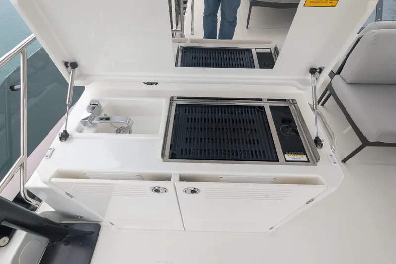  Yacht Photos Pics Outdoor kitchen on 2024 Prestige M48 yacht with grill and sink.
