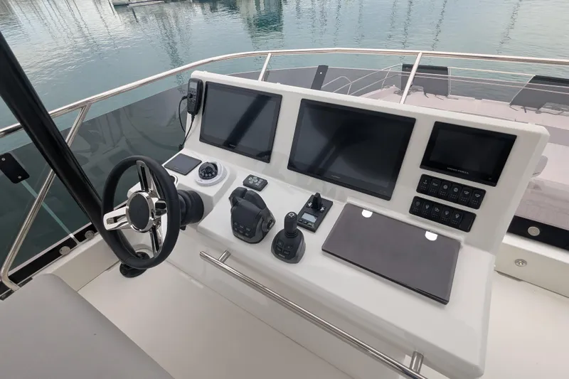  Yacht Photos Pics 2024 Prestige M48 yacht helm with modern navigation screens and controls.