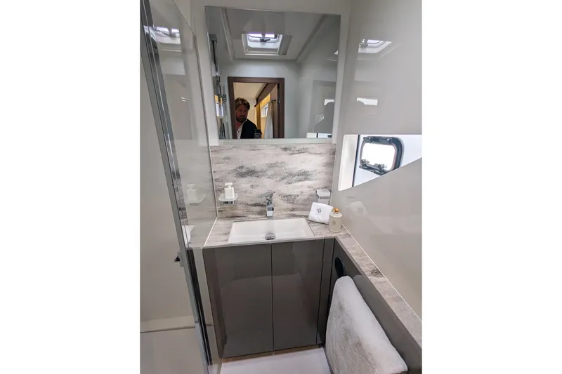  Yacht Photos Pics Modern bathroom interior in 2024 Prestige M48 yacht, featuring sleek design and elegant fixtures.