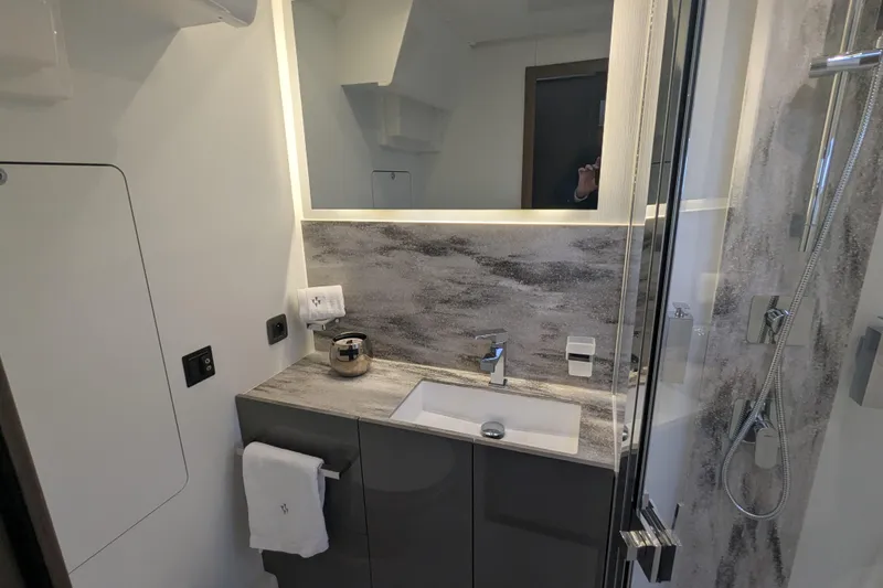  Yacht Photos Pics Modern bathroom in 2024 Prestige M48 yacht with sleek fixtures and elegant design.