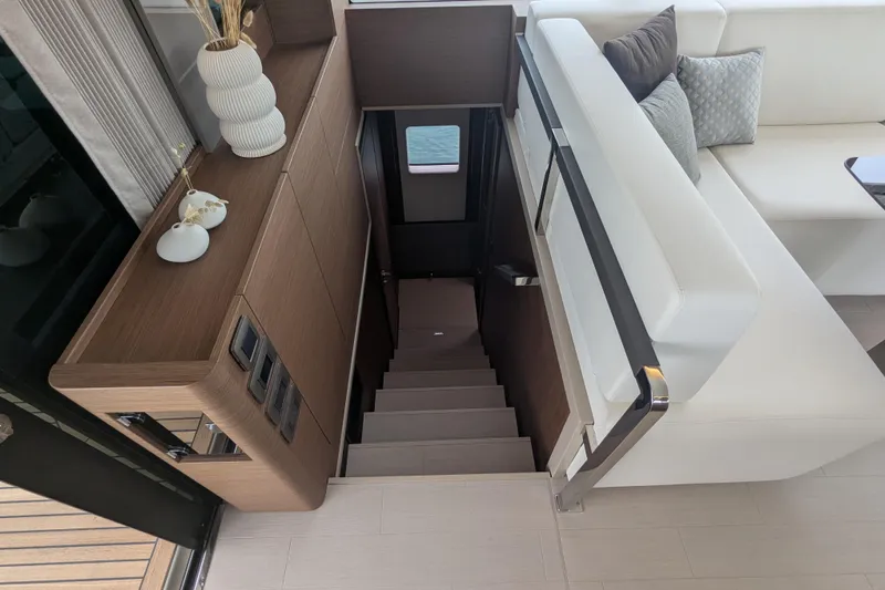  Yacht Photos Pics Luxurious interior of 2024 Prestige M48 yacht with elegant staircase and modern decor.