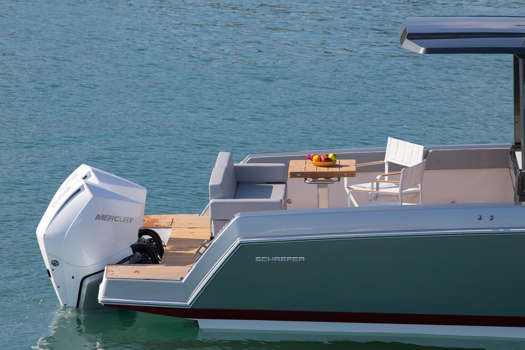 2026 Schaefer V33 boat with Mercury engine, featuring a stylish deck and seating area.