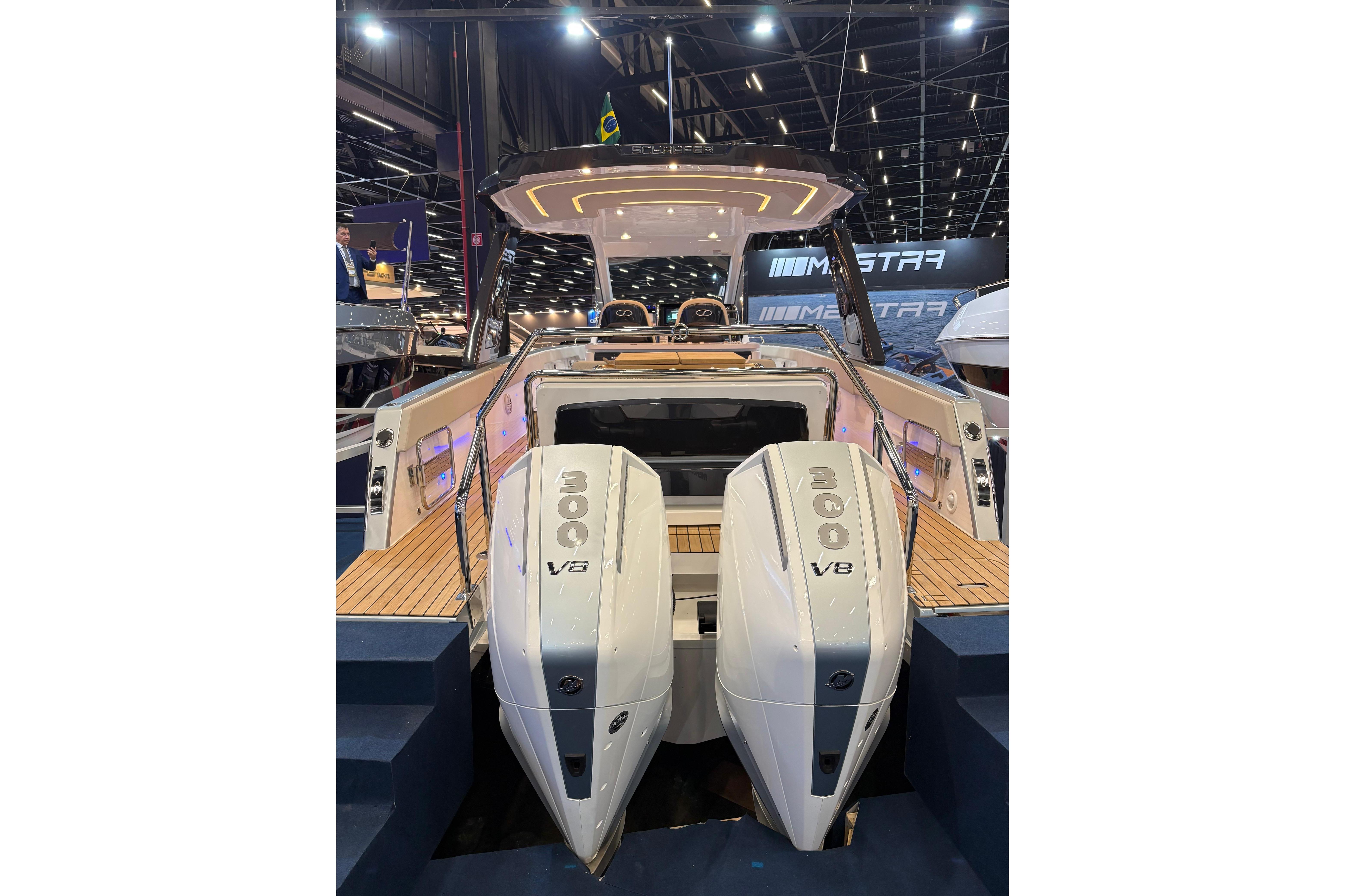 2026 Schaefer V34 yacht with dual 300 V8 engines at a boat show.