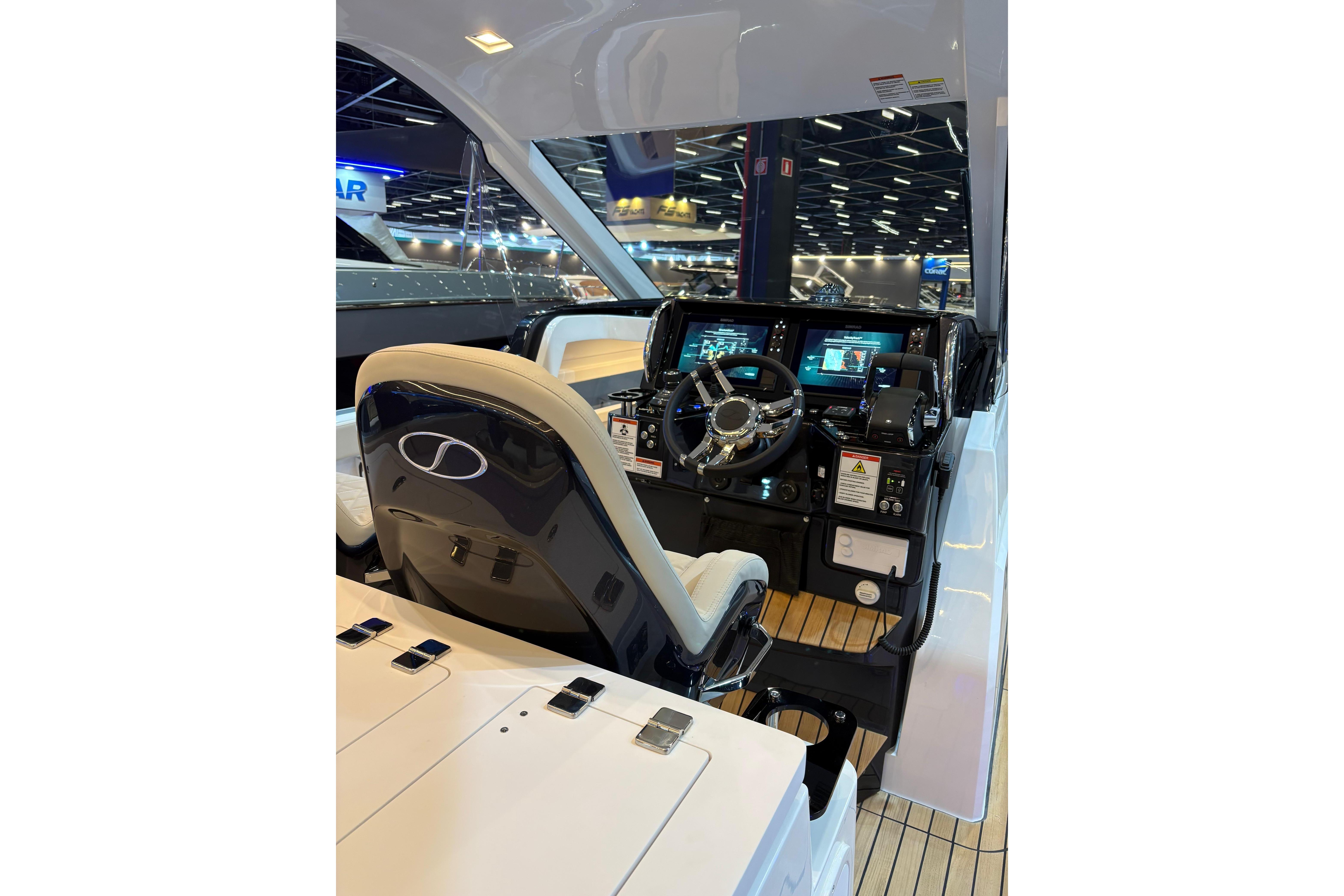 Helm of 2026 Schaefer V34 yacht with modern controls and navigation displays.