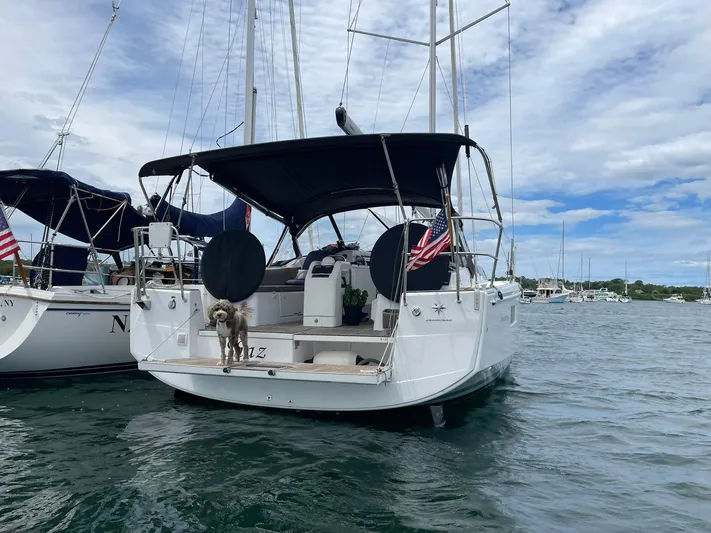 Shaz Yacht Photos Pics Jeanneau Sun Odyssey 410 sailboat, 2020 model, docked with a dog on deck.