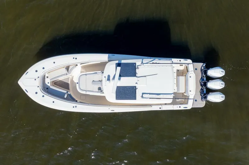  Yacht Photos Pics Aerial view of 2023 Scout 355 LXF boat with triple outboard engines.