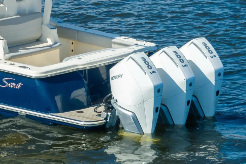  Yacht Photos Pics 2023 Scout 355 LXF boat with triple Mercury 300 V8 engines on water.