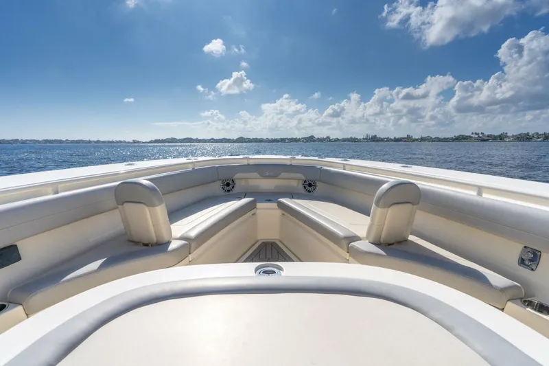  Yacht Photos Pics 2023 Scout 355 LXF boat interior with luxurious seating, under a clear blue sky.
