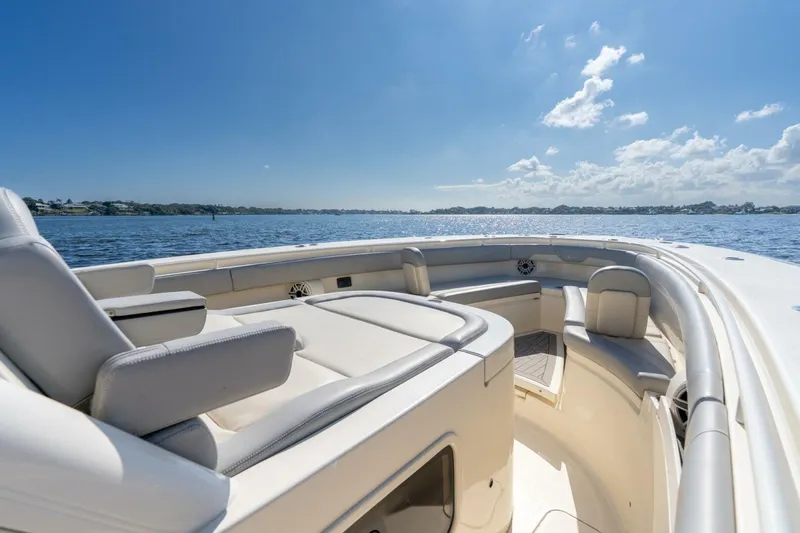  Yacht Photos Pics 2023 Scout 355 LXF boat interior with luxurious seating on a sunny day.