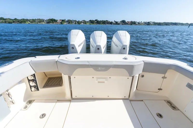  Yacht Photos Pics 2023 Scout 355 LXF boat with triple Mercury engines on open water.