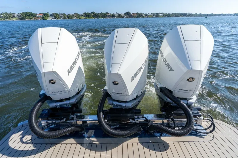  Yacht Photos Pics 2023 Scout 355 LXF boat with triple Mercury Verado outboard engines on water.