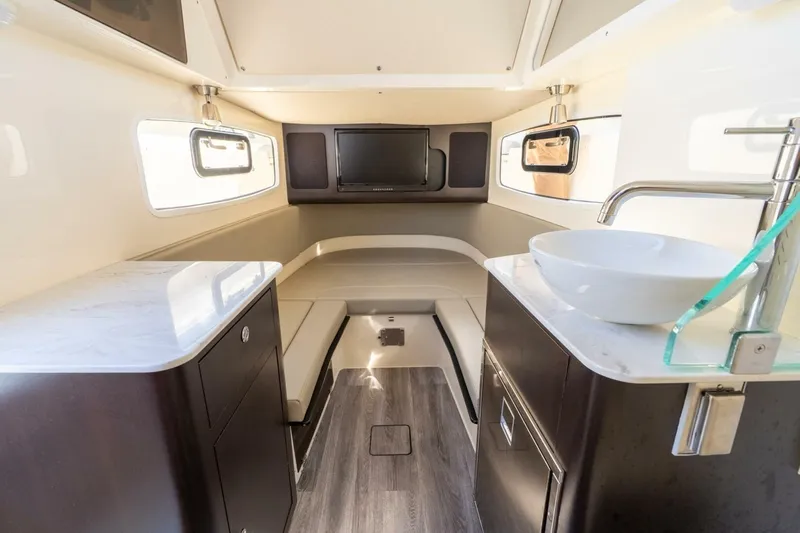  Yacht Photos Pics 2023 Scout 355 LXF cabin interior with modern amenities and sleek design.
