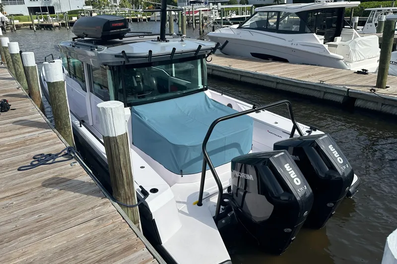  Yacht Photos Pics 2024 Axopar 37XC boat docked with twin Mercury outboard engines.