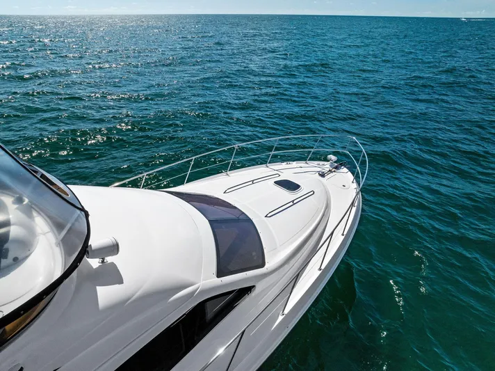 Megusta Yacht Photos Pics 2007 Sea Ray 44 Sedan Bridge yacht cruising on open ocean waters.