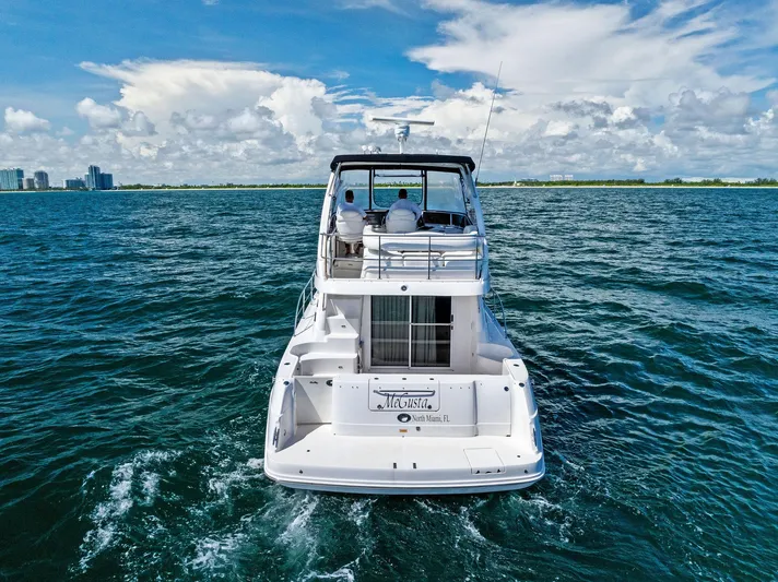 Megusta Yacht Photos Pics 2007 Sea Ray 44 Sedan Bridge yacht cruising on open water.