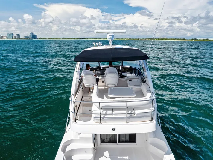 Megusta Yacht Photos Pics 2007 Sea Ray 44 Sedan Bridge yacht cruising on open water.