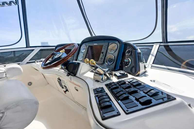 Megusta Yacht Photos Pics 2007 Sea Ray 44 Sedan Bridge helm with modern controls and navigation system.