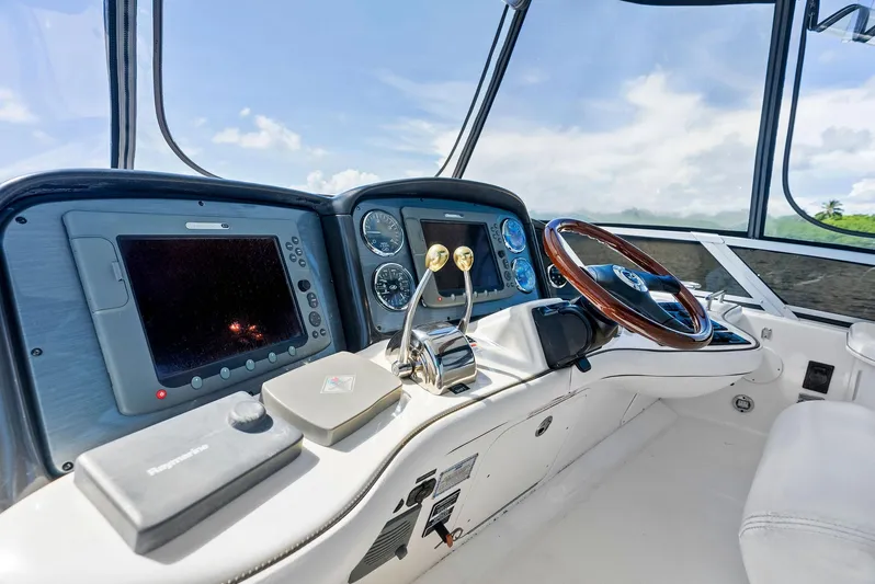 Megusta Yacht Photos Pics 2007 Sea Ray 44 Sedan Bridge helm with modern navigation controls and steering wheel.