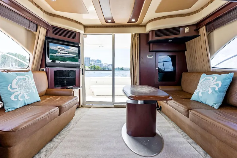 Megusta Yacht Photos Pics Luxurious interior of 2007 Sea Ray 44 Sedan Bridge yacht with plush seating and elegant decor.