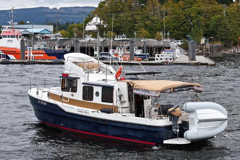  Yacht Photos Pics 2015 Ranger Tugs R-31 CB boat docked in a scenic marina setting.