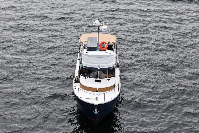  Yacht Photos Pics 2015 Ranger Tugs R-31 CB boat on open water, aerial view.