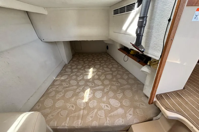  Yacht Photos Pics 2015 Ranger Tugs R-31 CB interior cabin with patterned mattress and storage shelf.