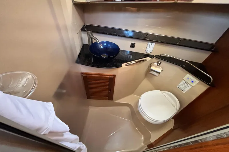  Yacht Photos Pics 2015 Ranger Tugs R-31 CB bathroom with modern sink and toilet.