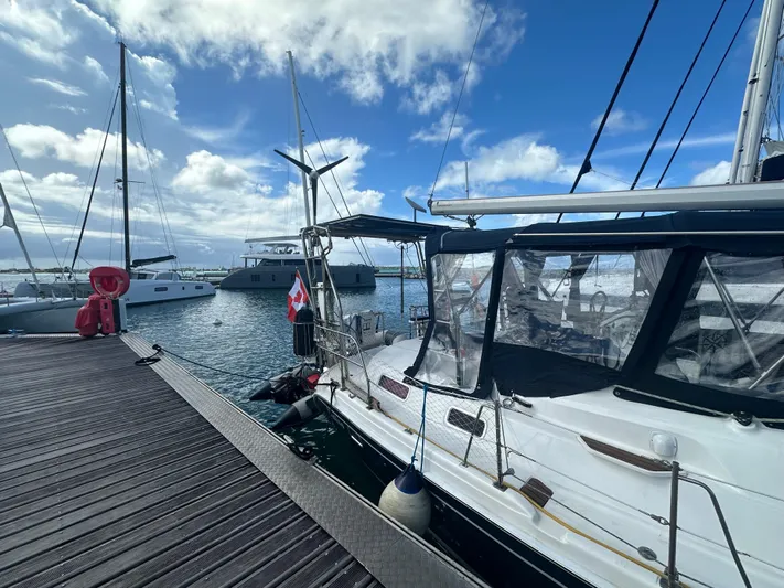 Talisa Yacht Photos Pics Sailboat docked at marina, Hunter 45cc, 2006 model, under a clear blue sky.