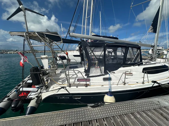 Talisa Yacht Photos Pics Sailboat docked at marina, 2006 Hunter 45cc model, clear skies, calm waters.