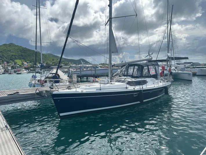 Talisa Yacht Photos Pics Sailboat docked in marina, 2006 Hunter 45cc, under cloudy sky.