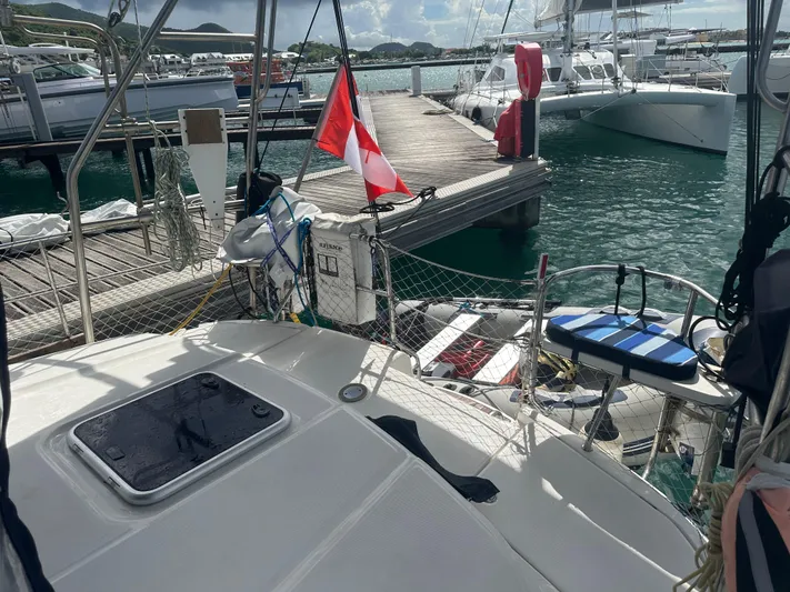 Talisa Yacht Photos Pics Sailboat docked at marina, featuring a 2006 Hunter 45cc with a Canadian flag.