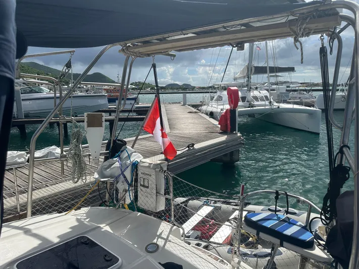 Talisa Yacht Photos Pics Sailboat docked at marina, featuring a 2006 Hunter 45cc with a Canadian flag.