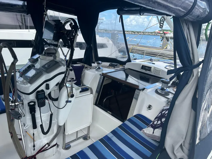 Talisa Yacht Photos Pics Interior view of a 2006 Hunter 45cc sailboat cockpit with navigation equipment.