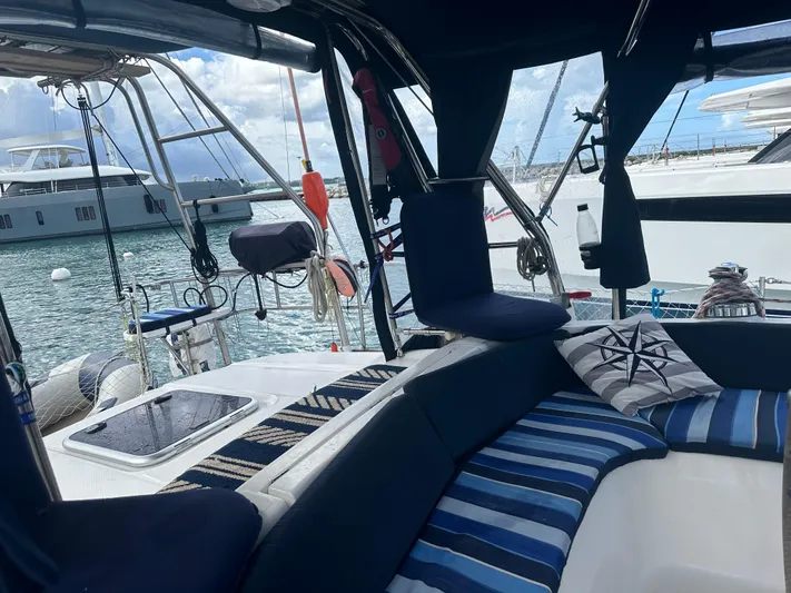 Talisa Yacht Photos Pics Interior of a 2006 Hunter 45cc yacht with striped cushions and marina view.