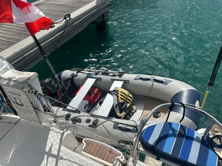 Talisa Yacht Photos Pics Inflatable boat docked beside a Hunter 45cc yacht, 2006 model, with a Canadian flag.
