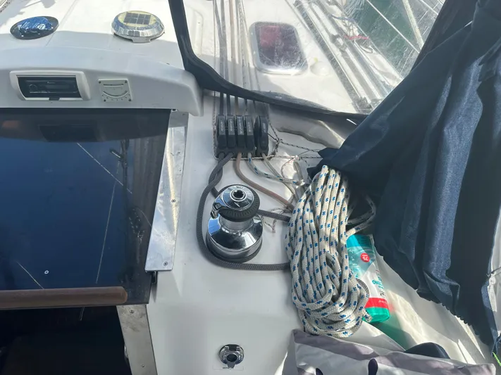 Talisa Yacht Photos Pics Cockpit of a 2006 Hunter 45cc sailboat with winch and ropes.