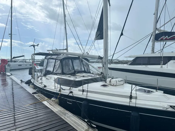 Talisa Yacht Photos Pics Sailboat docked at marina, Hunter 45cc, 2006 model, overcast sky.