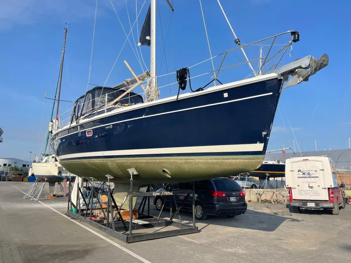Talisa Yacht Photos Pics 2006 Hunter 45cc sailboat on dry dock, blue hull, marina setting.
