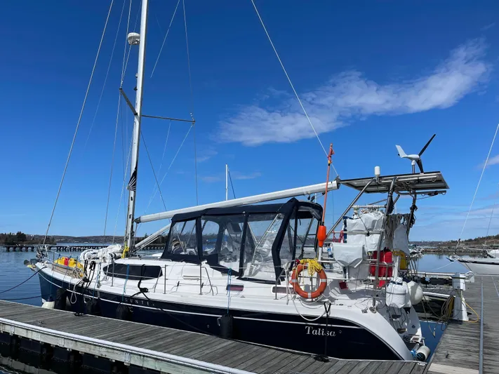 Talisa Yacht Photos Pics Sailboat docked at marina, Hunter 45cc model, 2006, under clear blue sky.