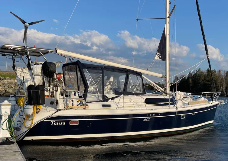 Talisa Yacht Photos Pics 2006 Hunter 45cc sailboat docked, featuring a sleek design and blue hull.