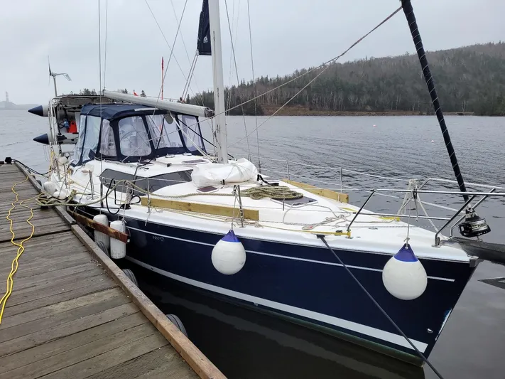 Talisa Yacht Photos Pics Sailboat docked by a lake, 2006 Hunter 45cc model.