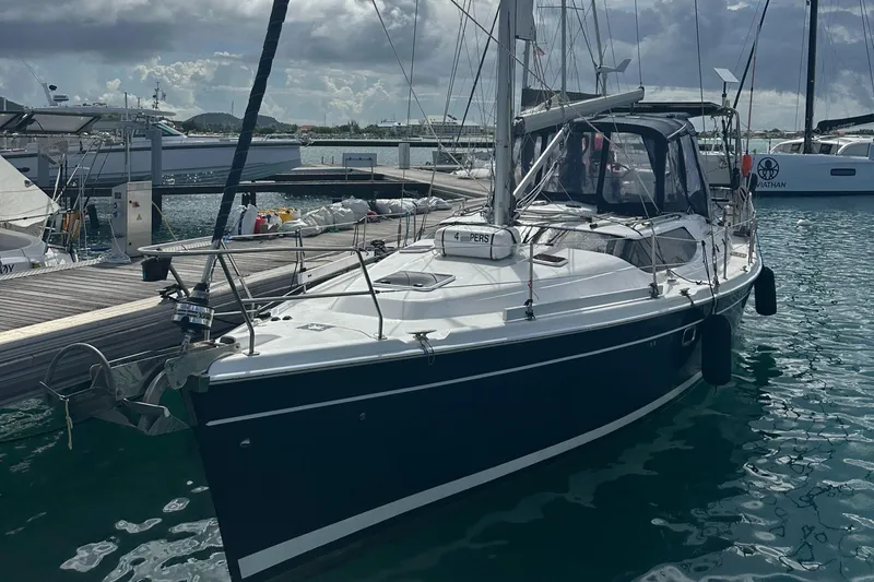 Talisa Yacht Photos Pics Sailboat docked at marina, Hunter 45cc, 2006 model, under cloudy sky.