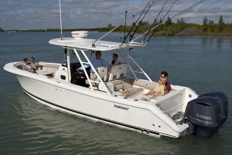  Yacht Photos Pics Manufacturer Provided Image: 2016 Pursuit ST 310 Sport boat cruising with passengers on a calm waterway.