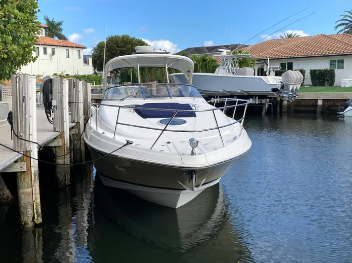  Yacht Photos Pics 2007 Regal 3760 Commodore yacht docked in a serene canal setting.