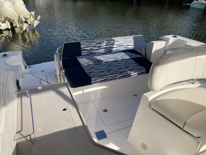  Yacht Photos Pics 2007 Regal 3760 Commodore boat interior with seating, docked by the water.