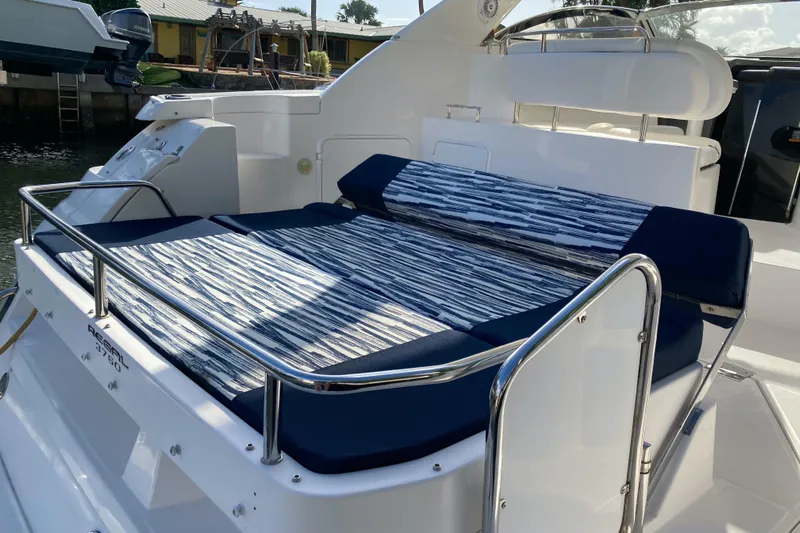  Yacht Photos Pics 2007 Regal 3760 Commodore yacht with striped sunbed on deck.