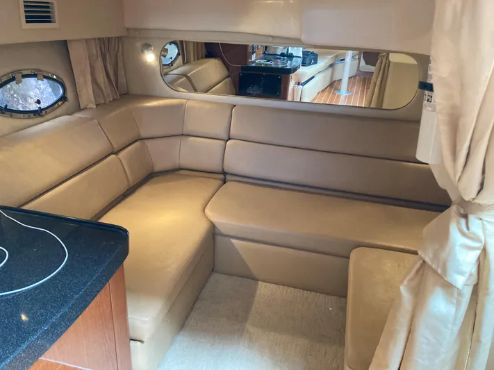  Yacht Photos Pics Luxurious interior of 2007 Regal 3760 Commodore yacht with beige leather seating.