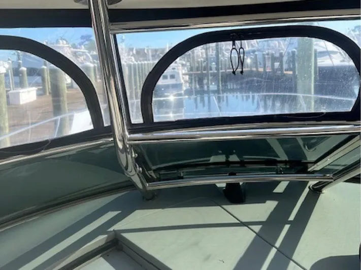  Yacht Photos Pics Interior view of 2005 Sea Ray 390 Sundancer yacht with marina backdrop.