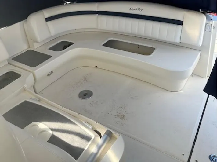  Yacht Photos Pics 2005 Sea Ray 390 Sundancer boat interior with white seating and storage compartments.